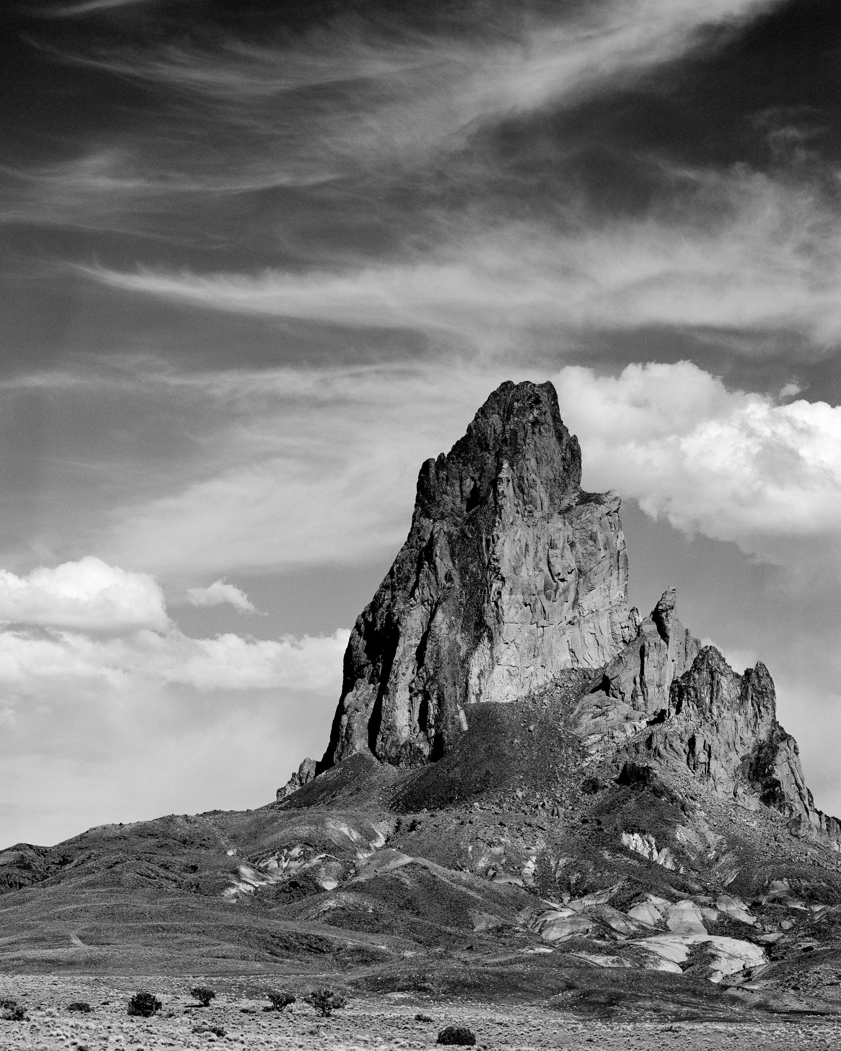 Agathla Peak rises more than 1,500 feet above the desert floor just south of Monument Valley, Arizona. Photograph by Marty Quinn